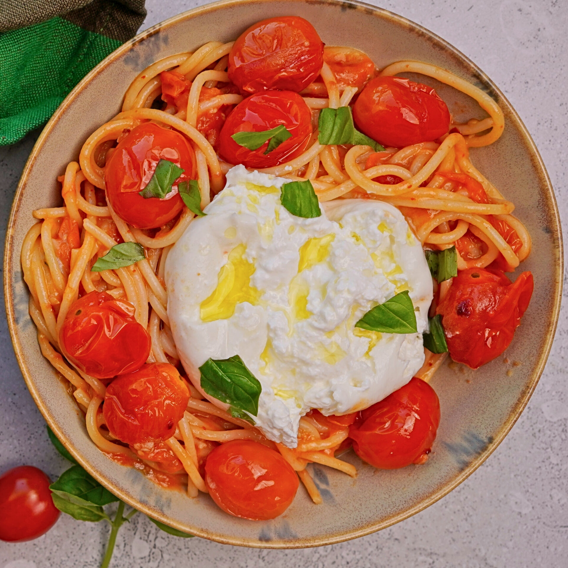 Creamy burrata pasta with cherry tomato sauce and burrata in the center.