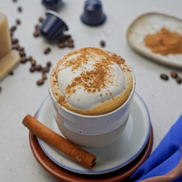 Cappuccino recipe without a machine, topped with frothy milk and cinnamon.