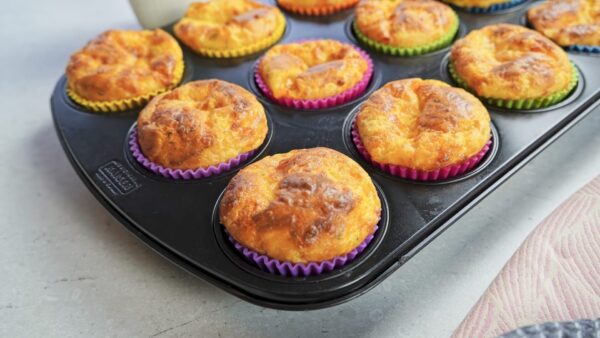 Muffins in the baking molds are fresh from the oven. Very crispy and soft.