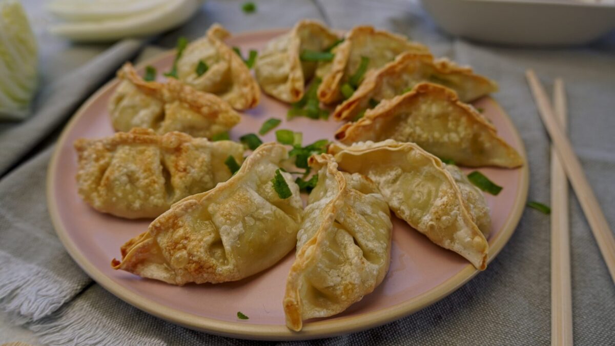 Extra crispy air-fried frozen gyoza on a plate, ready to eat.