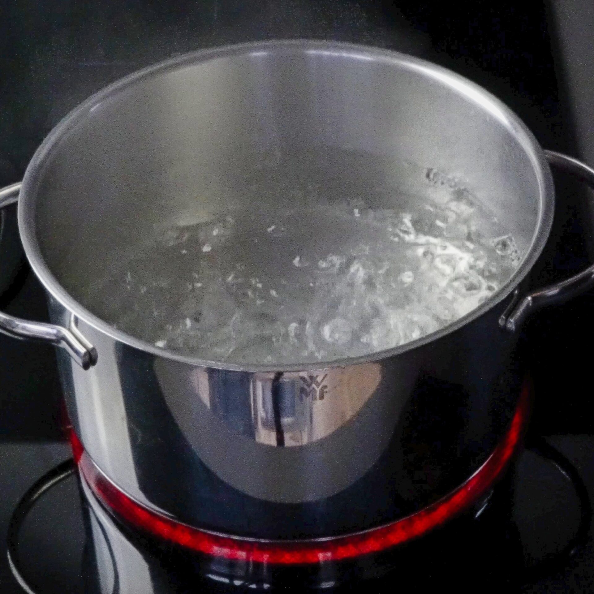 Boiling water in a pot, ready for cooking pasta.