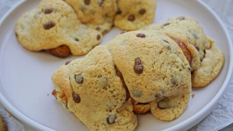 Croissant cookie on a plate with crispy cookie dough topping.