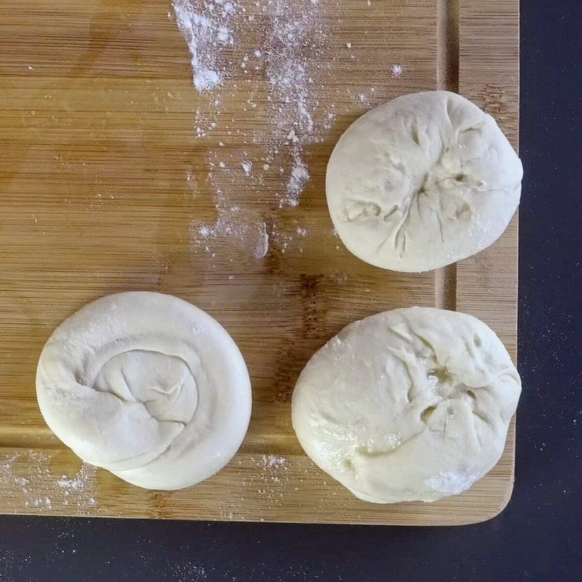 Forming snail-shaped dough to create flaky layers.