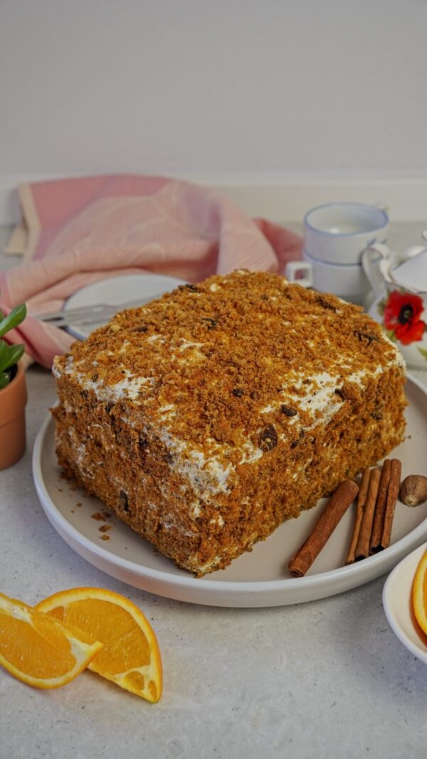 Carrot cake with cream cheese frosting, frozen and defrosted, ready to serve.