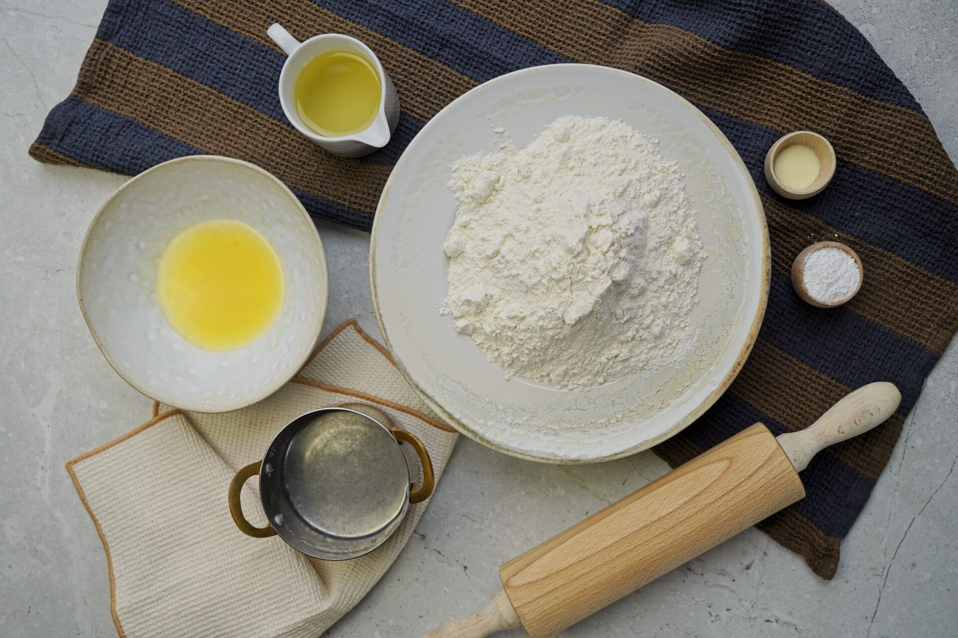 Ingredients for Guyanese roti recipe: all-purpose flour, baking powder, salt, warm water, sunflower oil and softened butter.