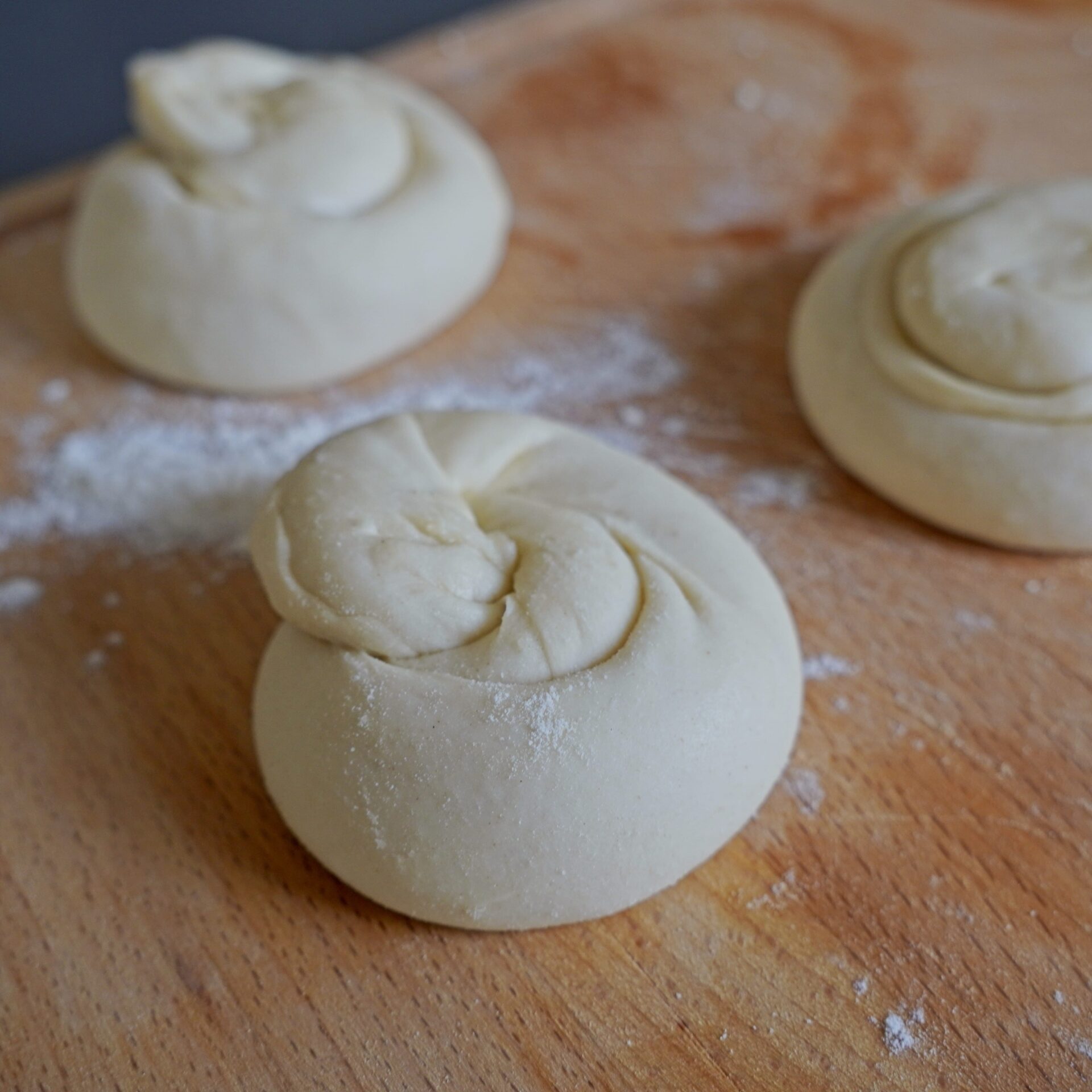 Traditional Guyanese method of shaping roti before cooking.