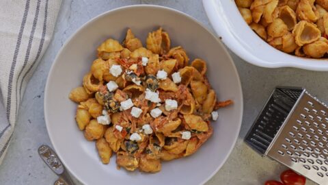 Freshly baked pasta with tomatoes, feta and olives.