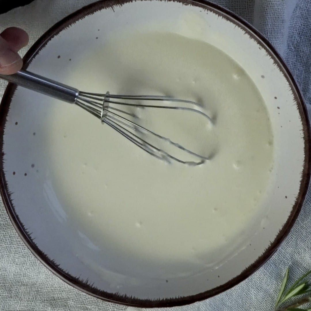 Clump-free creamy mixture in a bowl, ready to add to the soup.