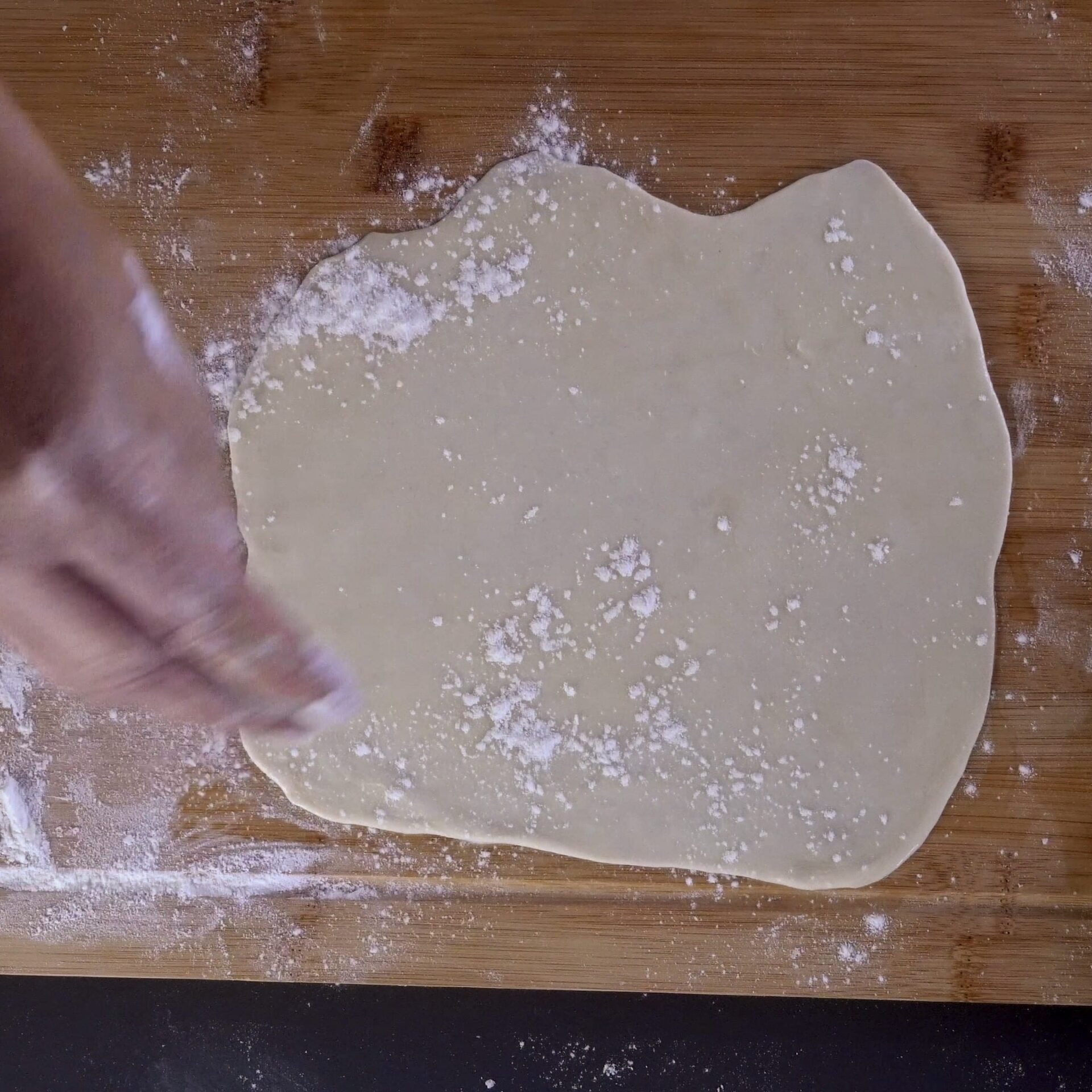 Sprinkling flour over the dough for the second method.